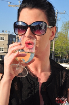 Redhead Mina in shades smoking frenzy drinking wine