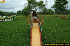 Outdoor pissing on a park slide - N