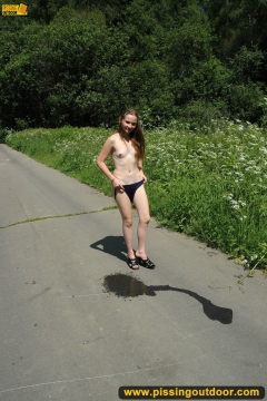 Teen girl pissing on asphalt outdoor - N