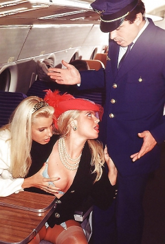Two blondes servicing the captain on an airplane - N