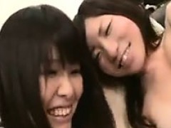 Sexy Asian lesbians play with each other and one is caught